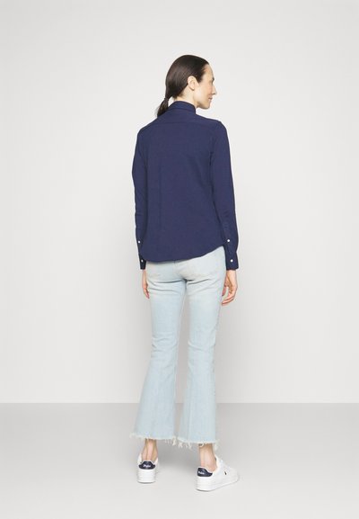 RL – Women's button-down shirt